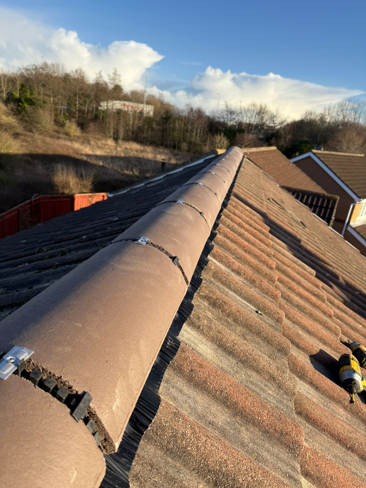 Roofers working on a pitched roof